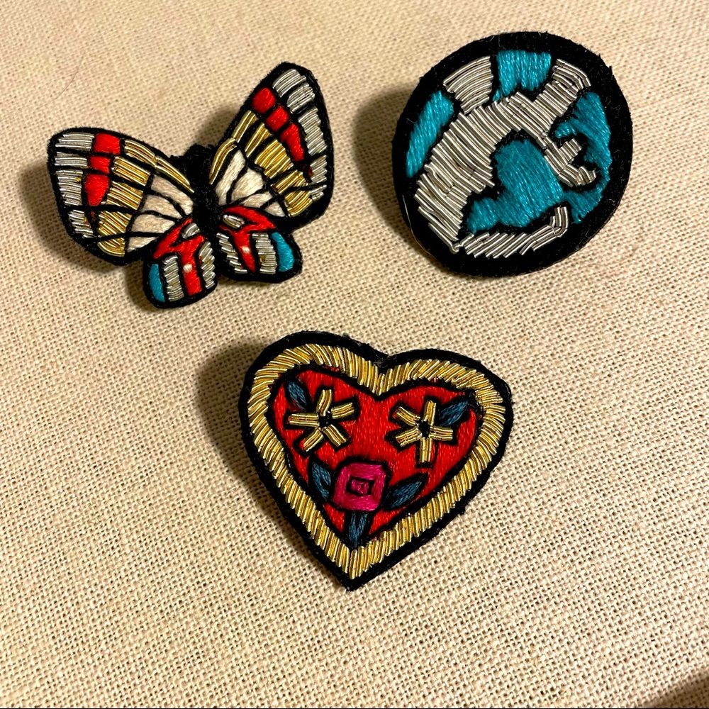 Trio of hand embroidered pins by Noonday Collection